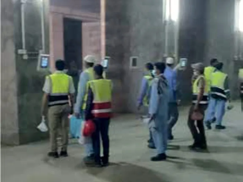 Site workers passing face-recognition access control terminals
